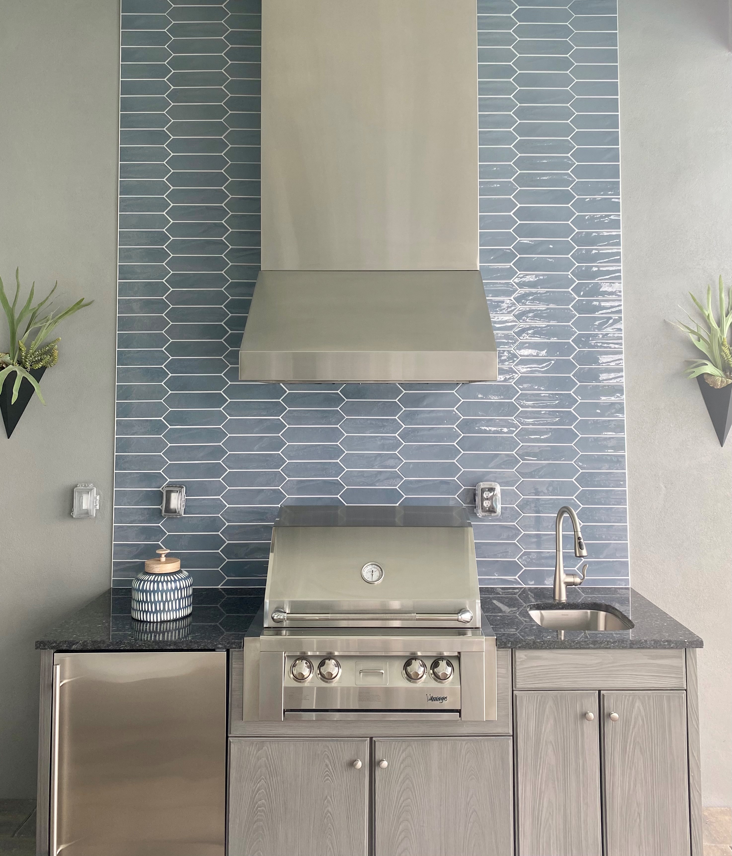 Custom outdoor kitchen and living space construction in Naples, FL by Custom Contracting & Consulting